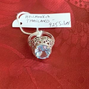 Blue topaz and 925 Silver ring. Beautiful style and design around stone